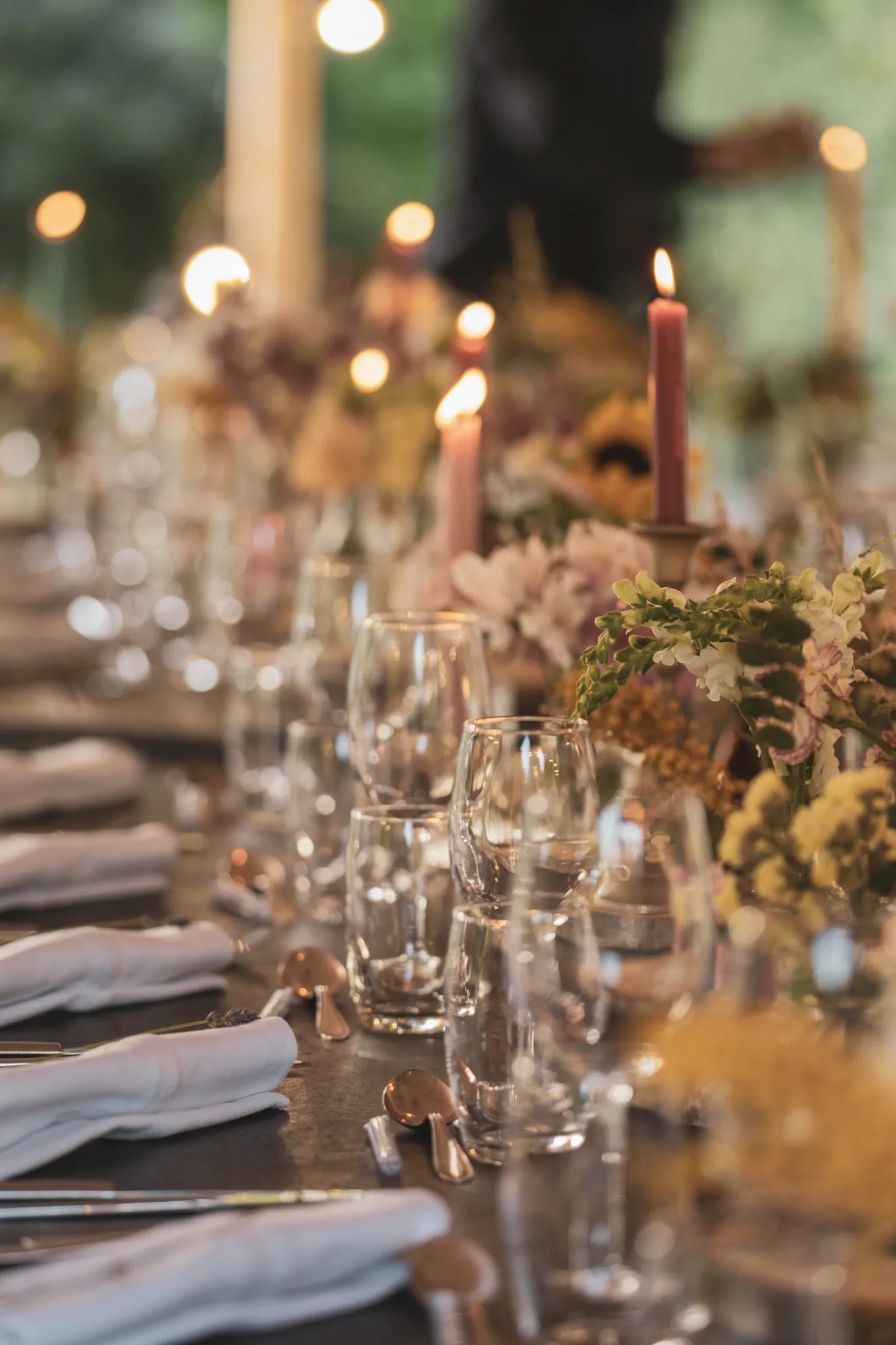 Reception table with candles and flowers